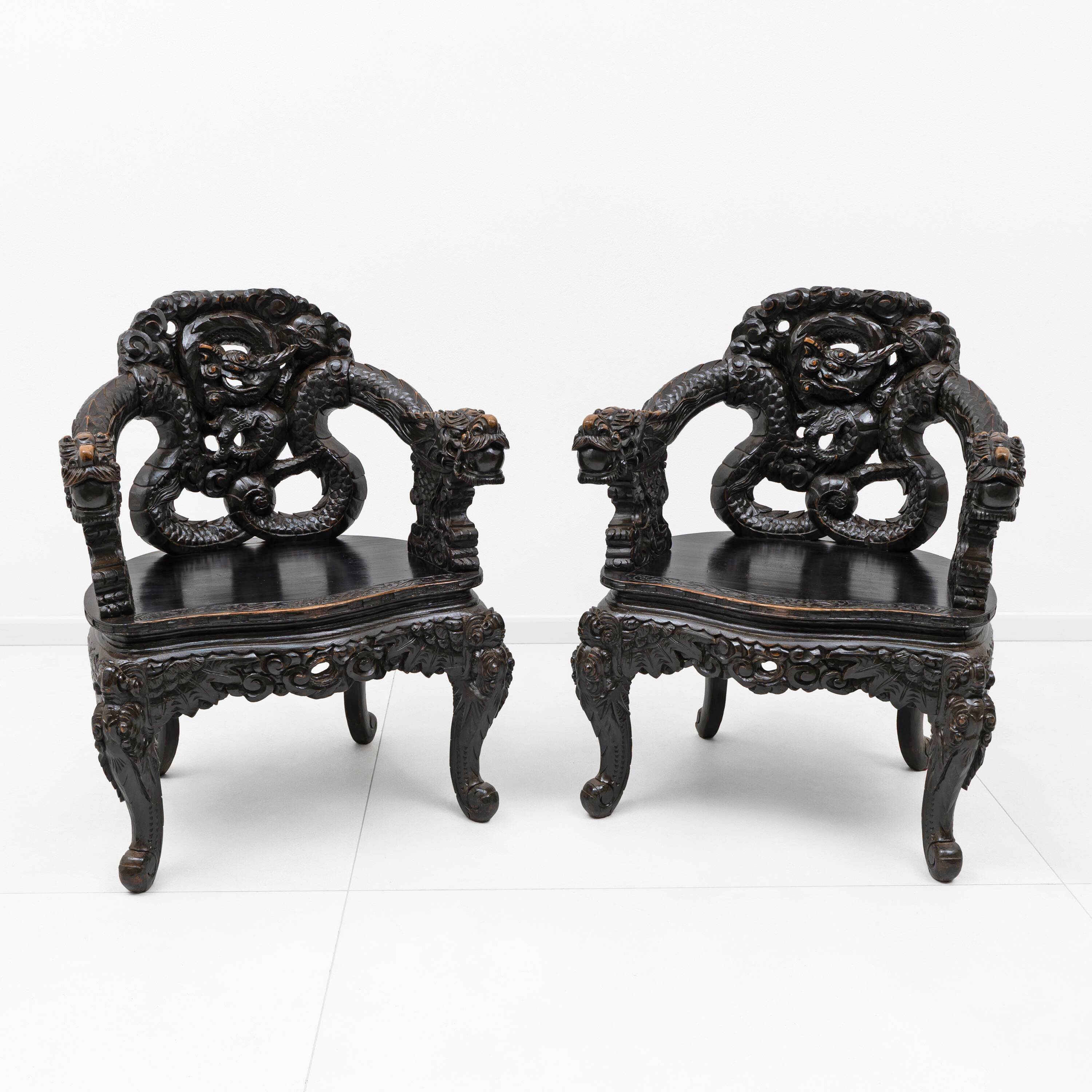 Pair of Chinese Qing Dynasty Carved Dragon Armchairs,Ebonized Hardwood,19th