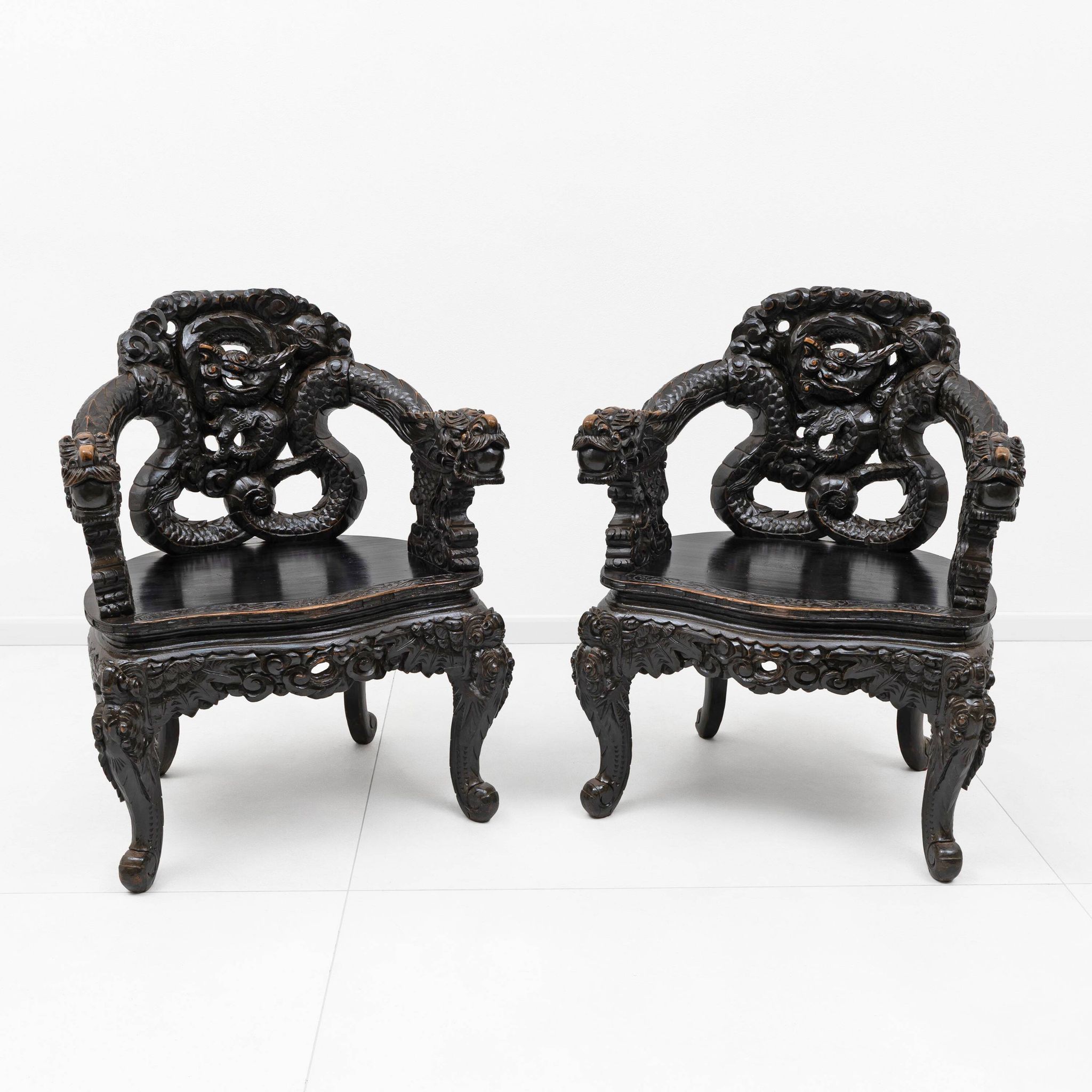 Pair of Chinese Qing Dynasty Carved Dragon Armchairs,Ebonized Hardwood,19th