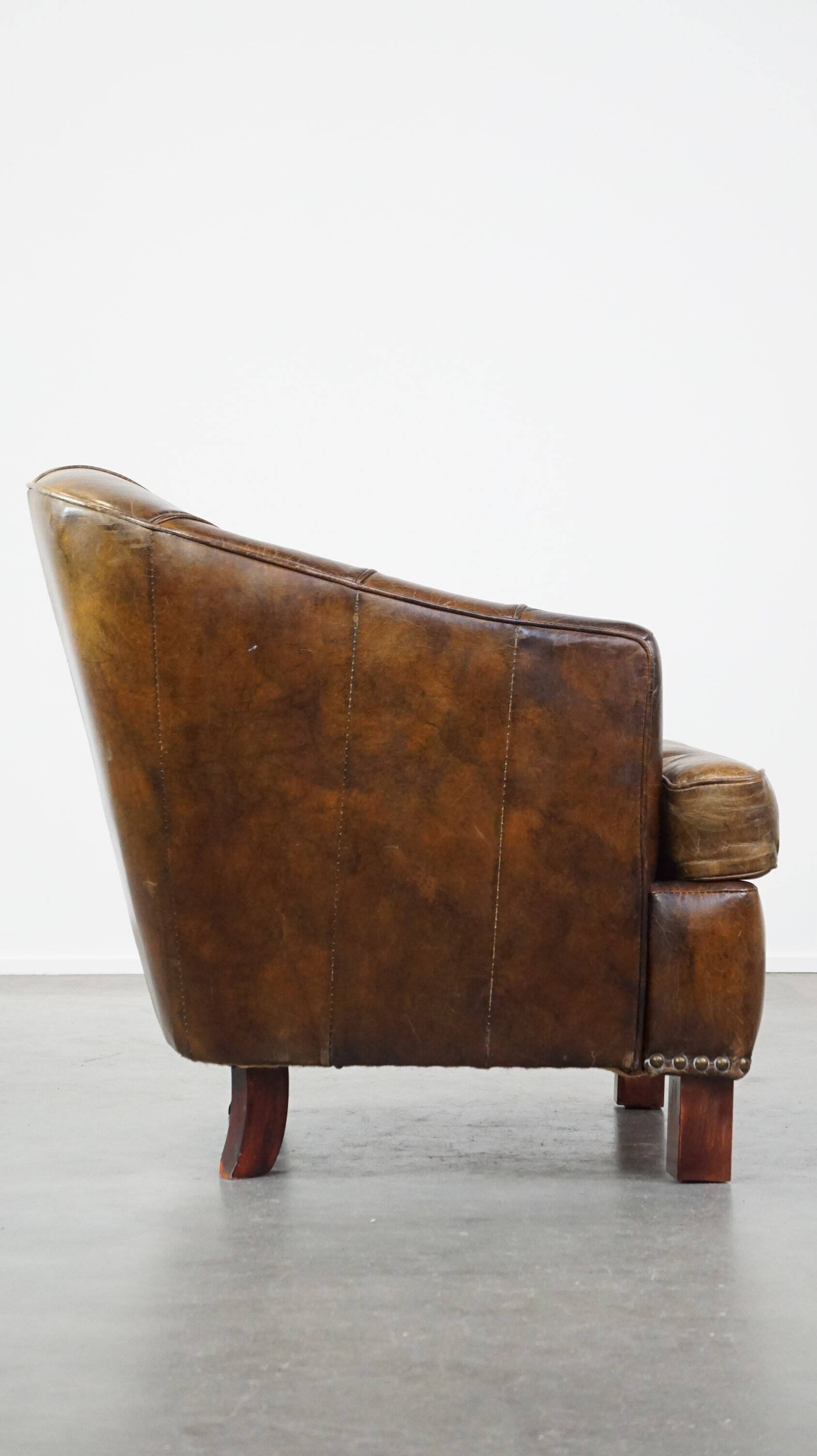 Stylish armchair with a unique design and beautiful finish, made of leather