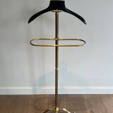 Neoclassical style valet stand in brass and black lacquered wood. French work. Circa 1940