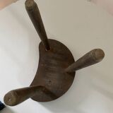 Antique tripod farm stool in brutalist style