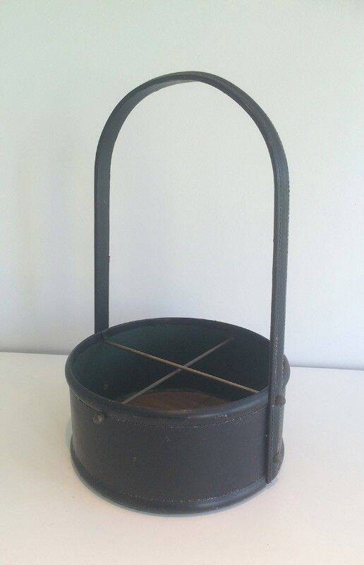 Leather wall magazine rack. In the style of Jacques Adnet.