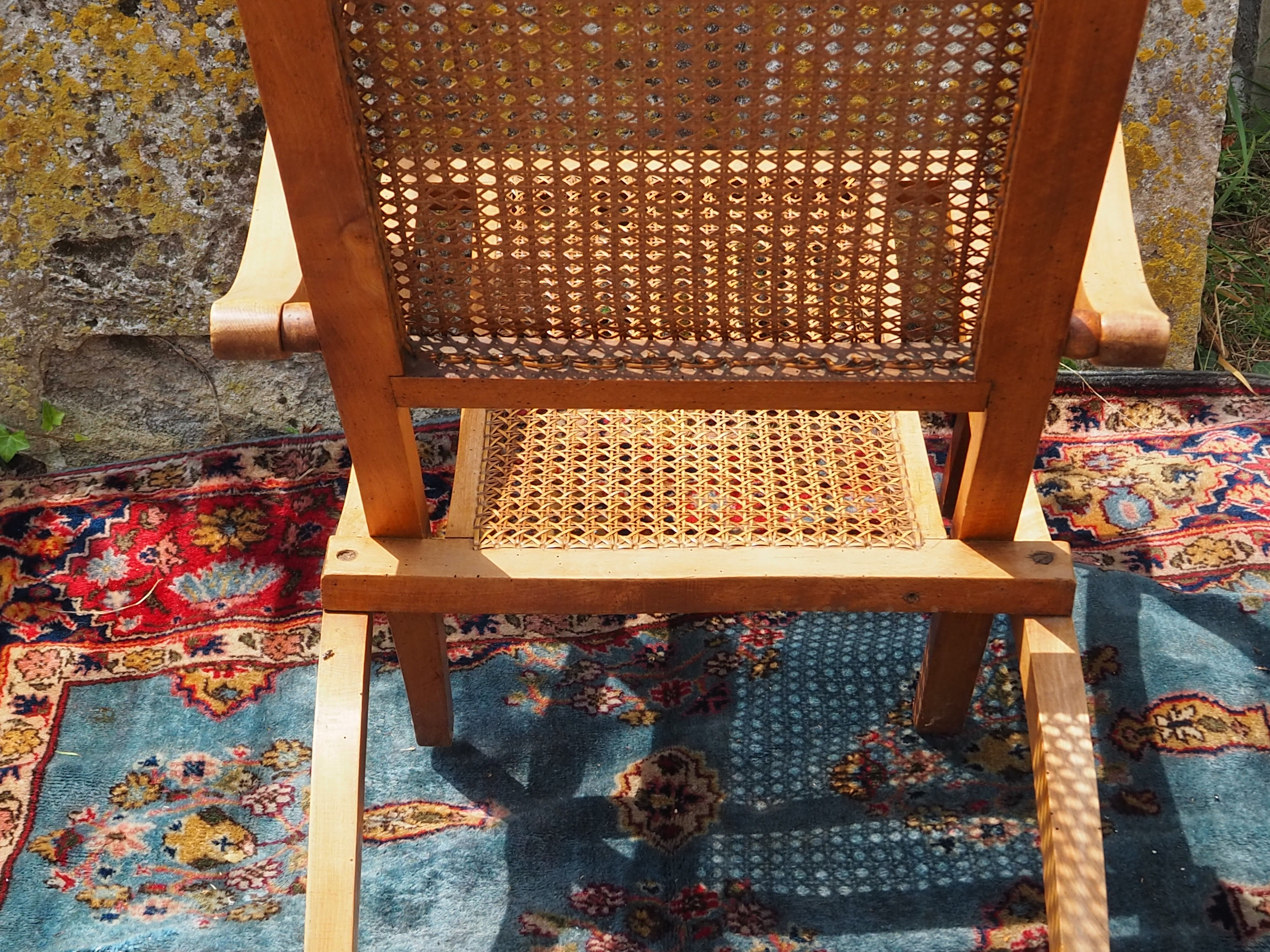 Cane folding armchair in solid wood