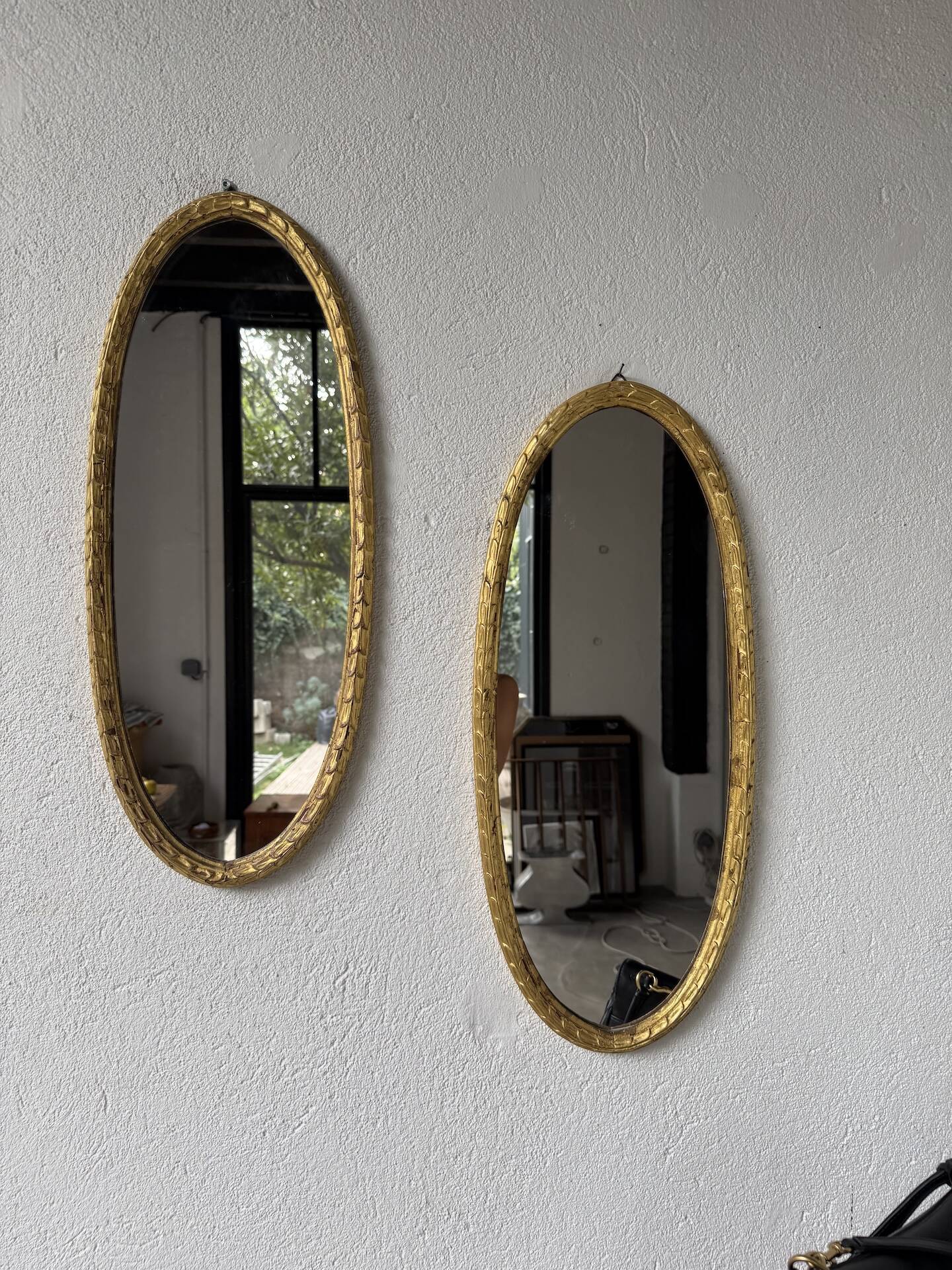 Pair of oval mirrors 1900 gilded stucco