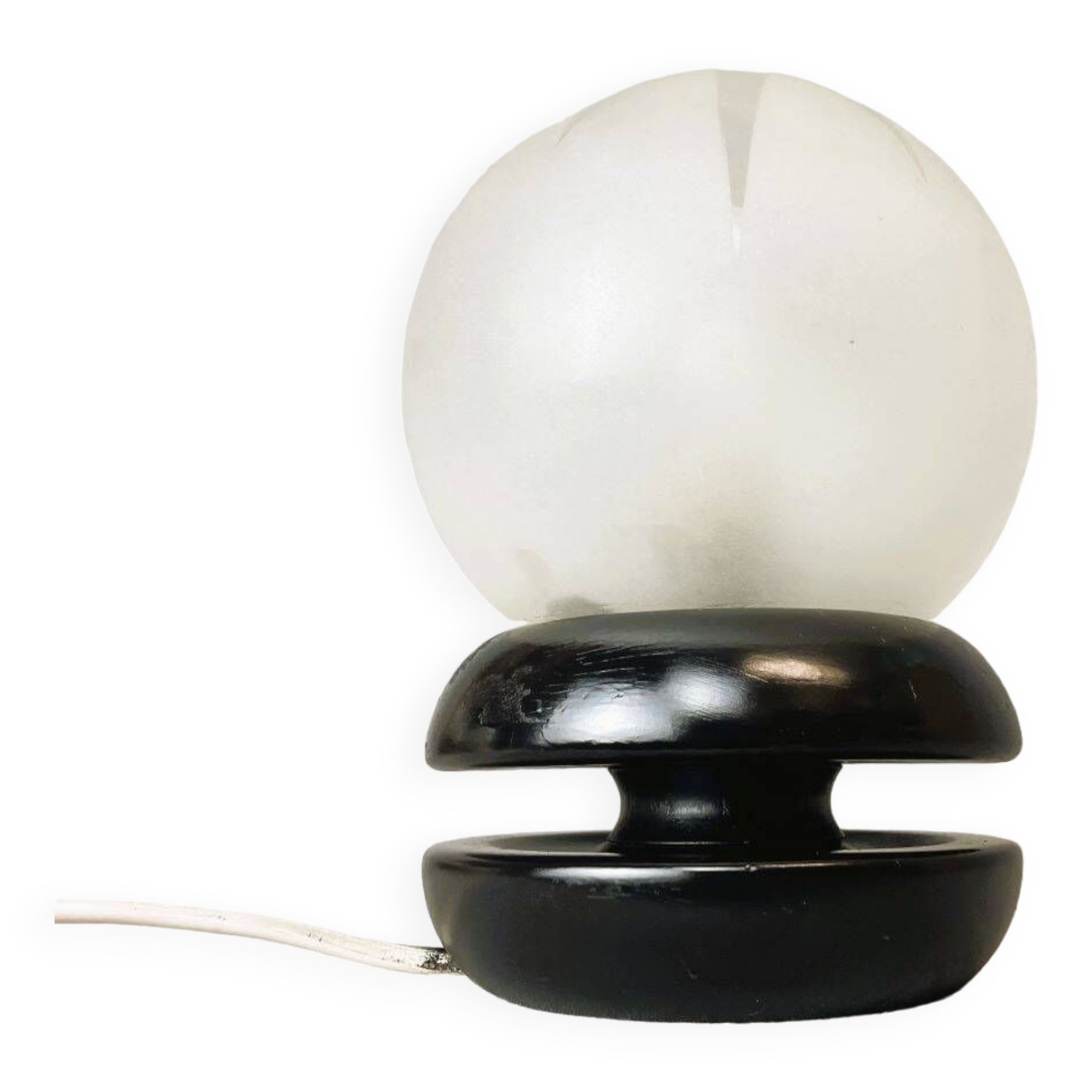 Small black wooden table lamp with frosted glass globe