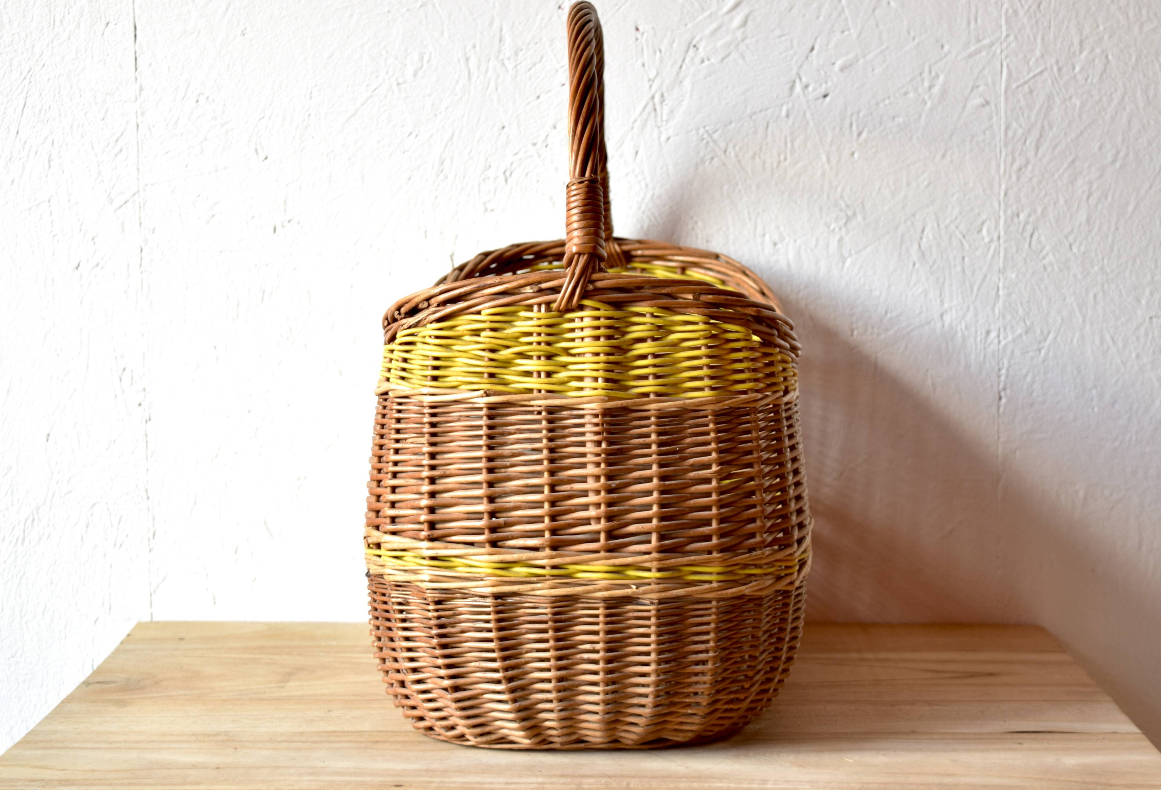 Vintage wicker basket crossed with a yellow scoubidou