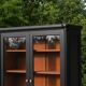 Renovated black antique Louis XVI style display cabinet, glass-fronted bookcase.