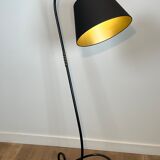 Design floor lamp in black lacquered metal and brass.