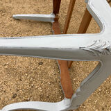 Louis XV style walnut table with a natural wood top.