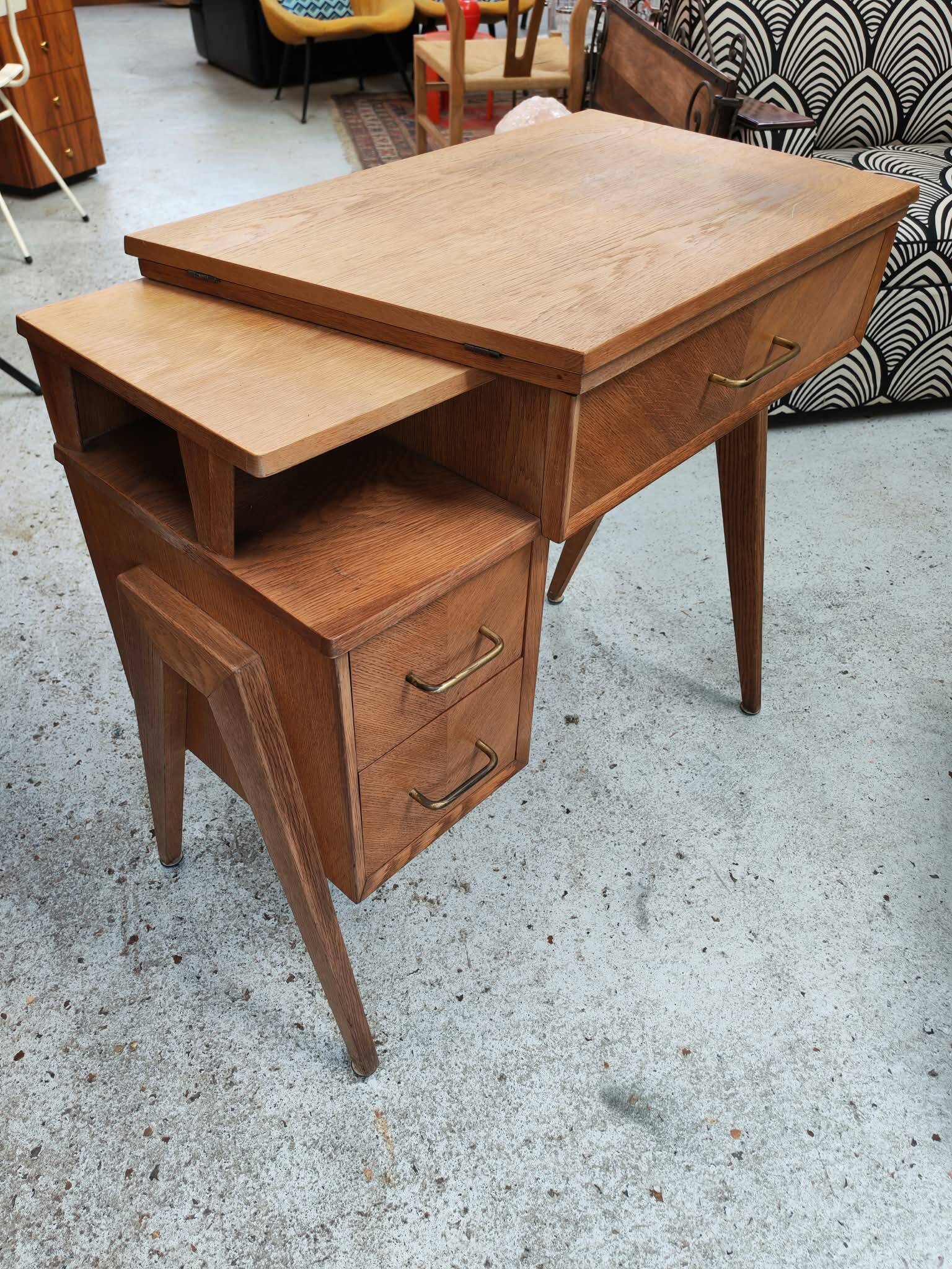 Vintage 1950s side desk with tapered legs.
