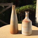 Bottle in sandstone or doilies