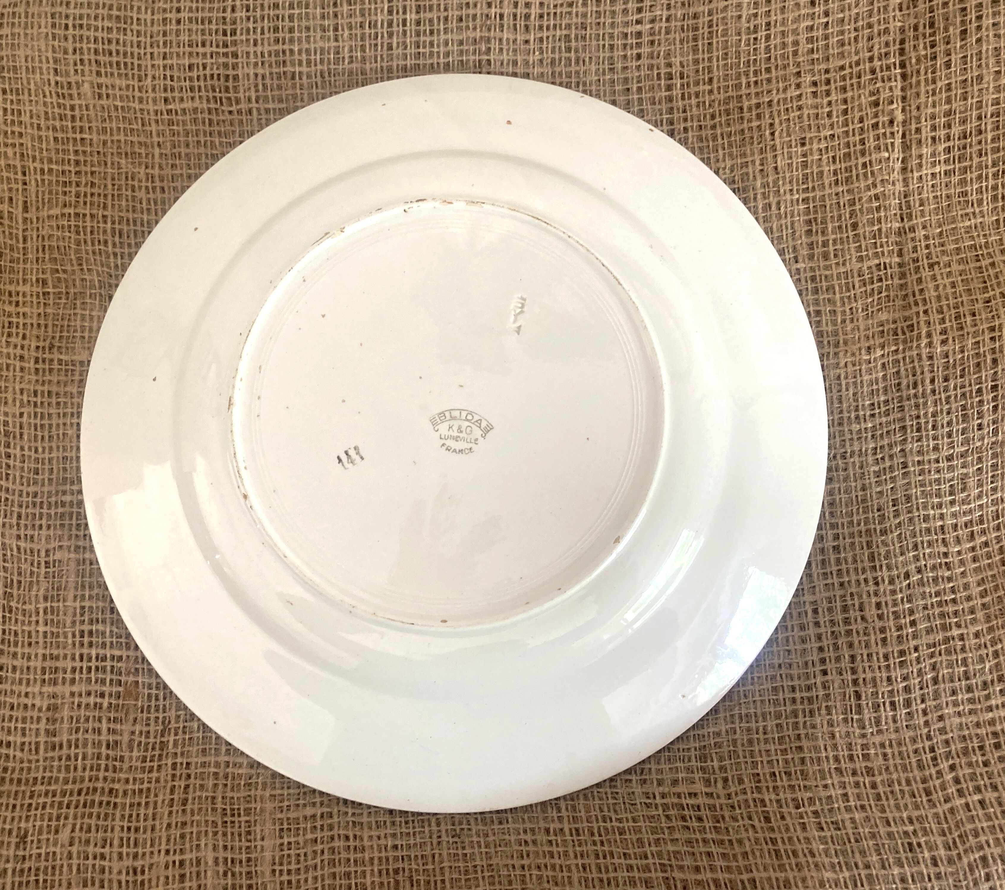 Round serving dish with burgundy red floral pattern