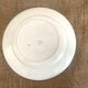Round serving dish with burgundy red floral pattern