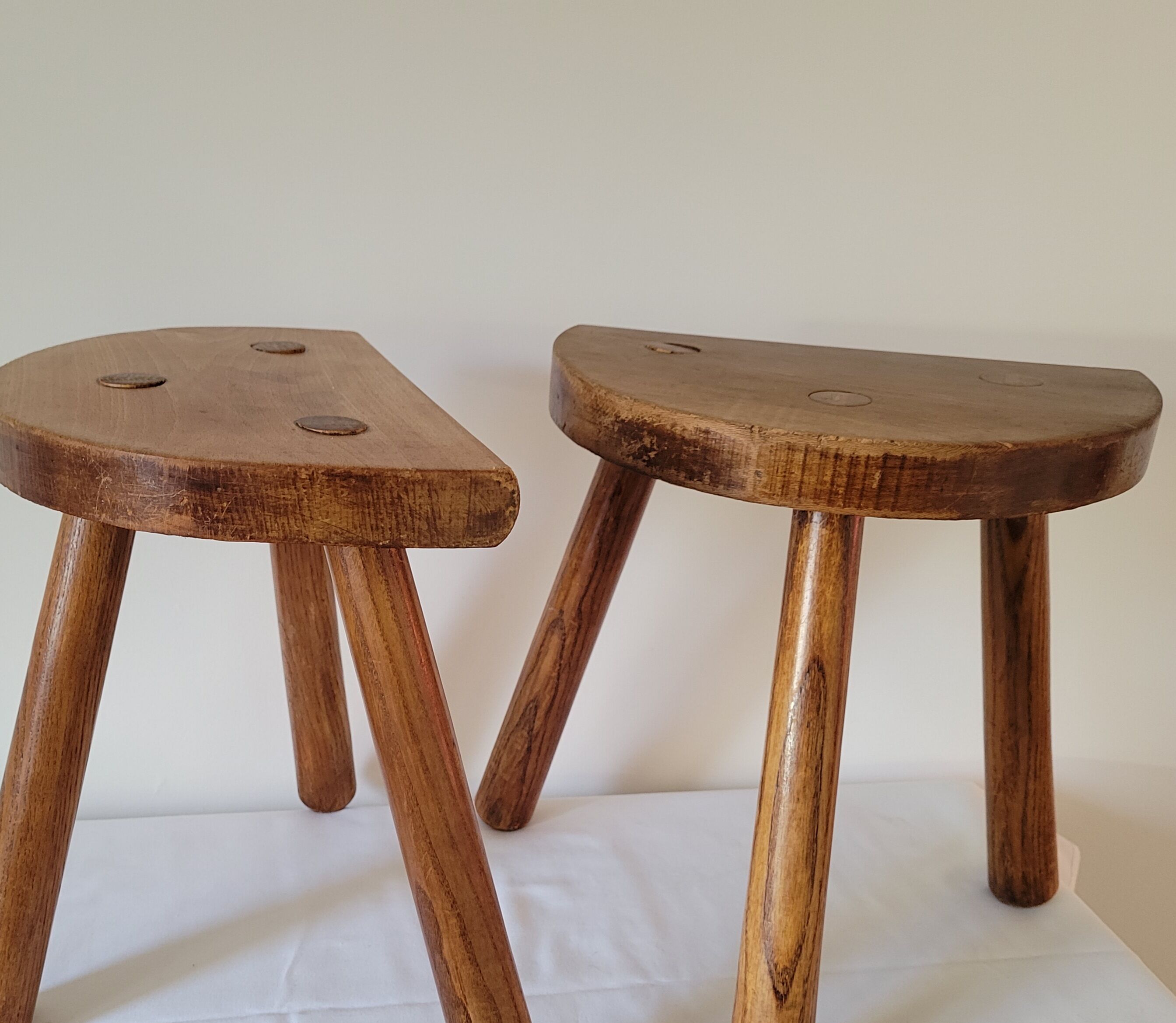 Pair of half-moon tripod stools
