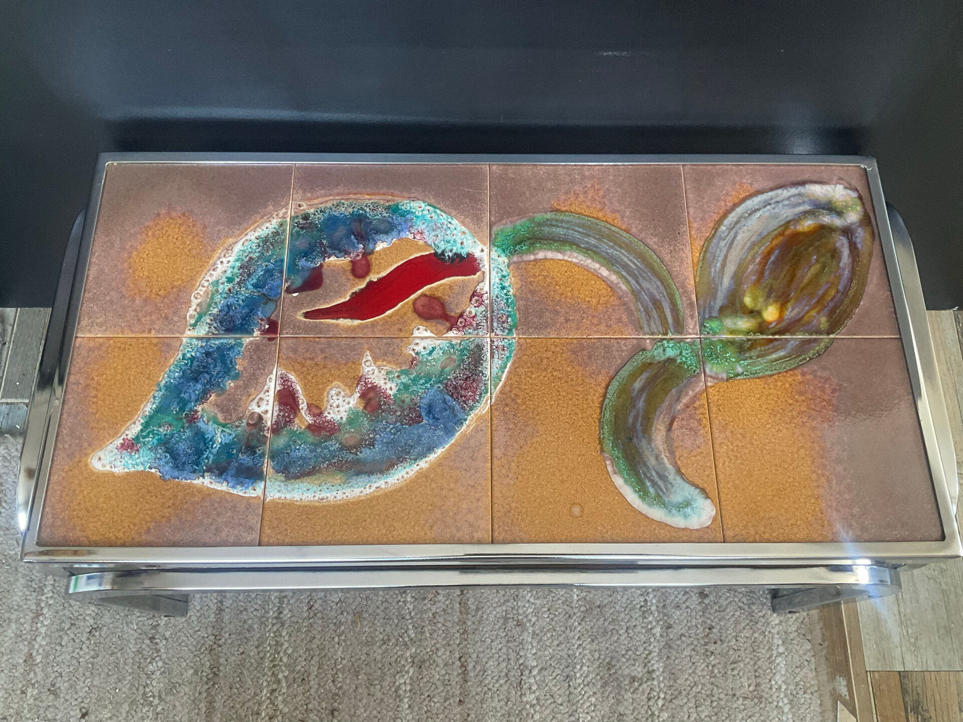 Vintage coffee table in stainless steel and ceramic from the 1970s.