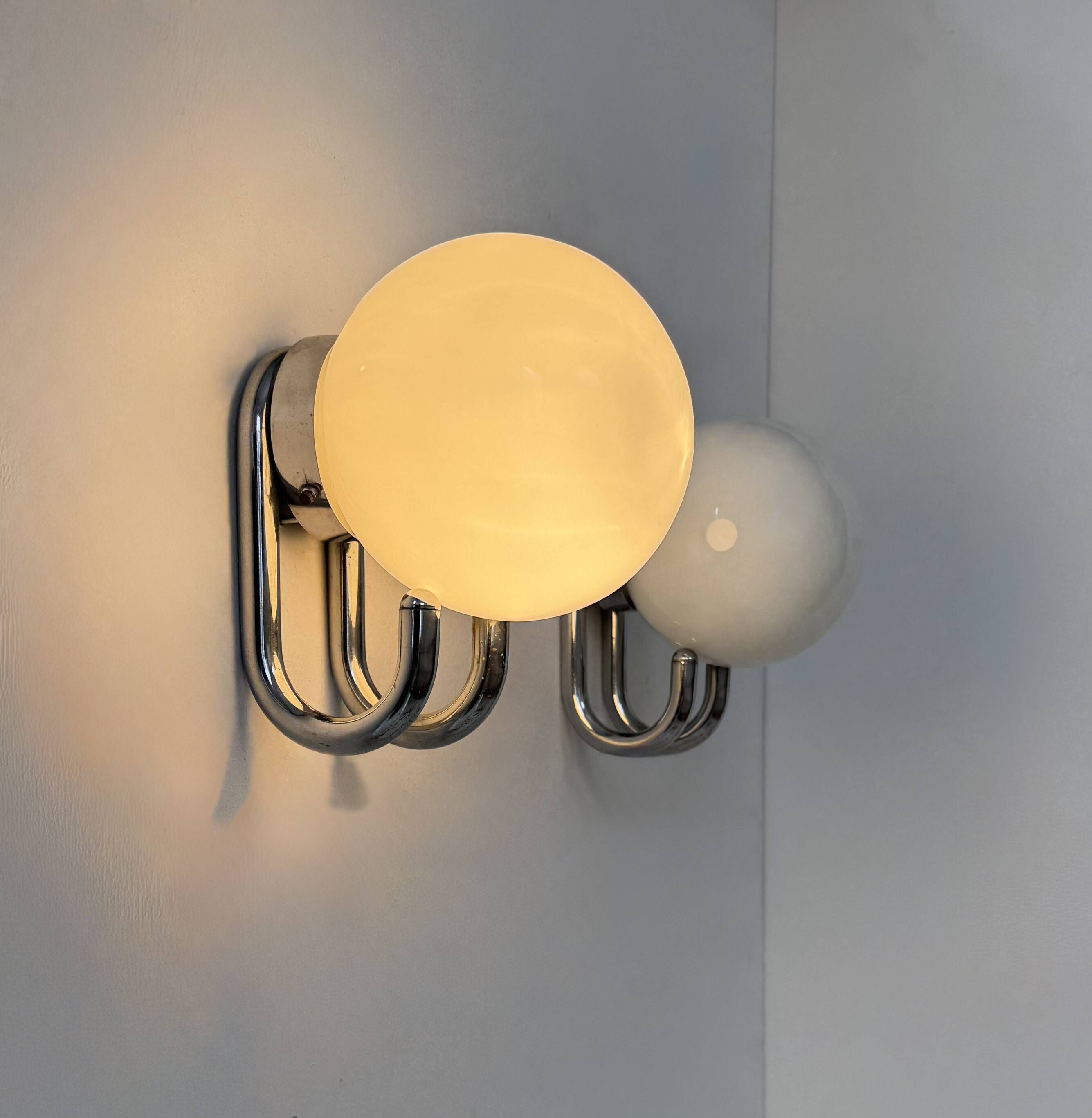 Pair of vintage wall lights, chrome metal and opaline, France, 1960.