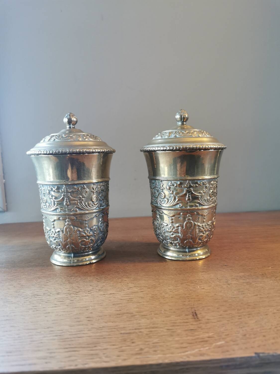 Pair of antique chiseled metal candy boxes