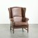 Cowhide wingback armchair in English style finished with decorative nails