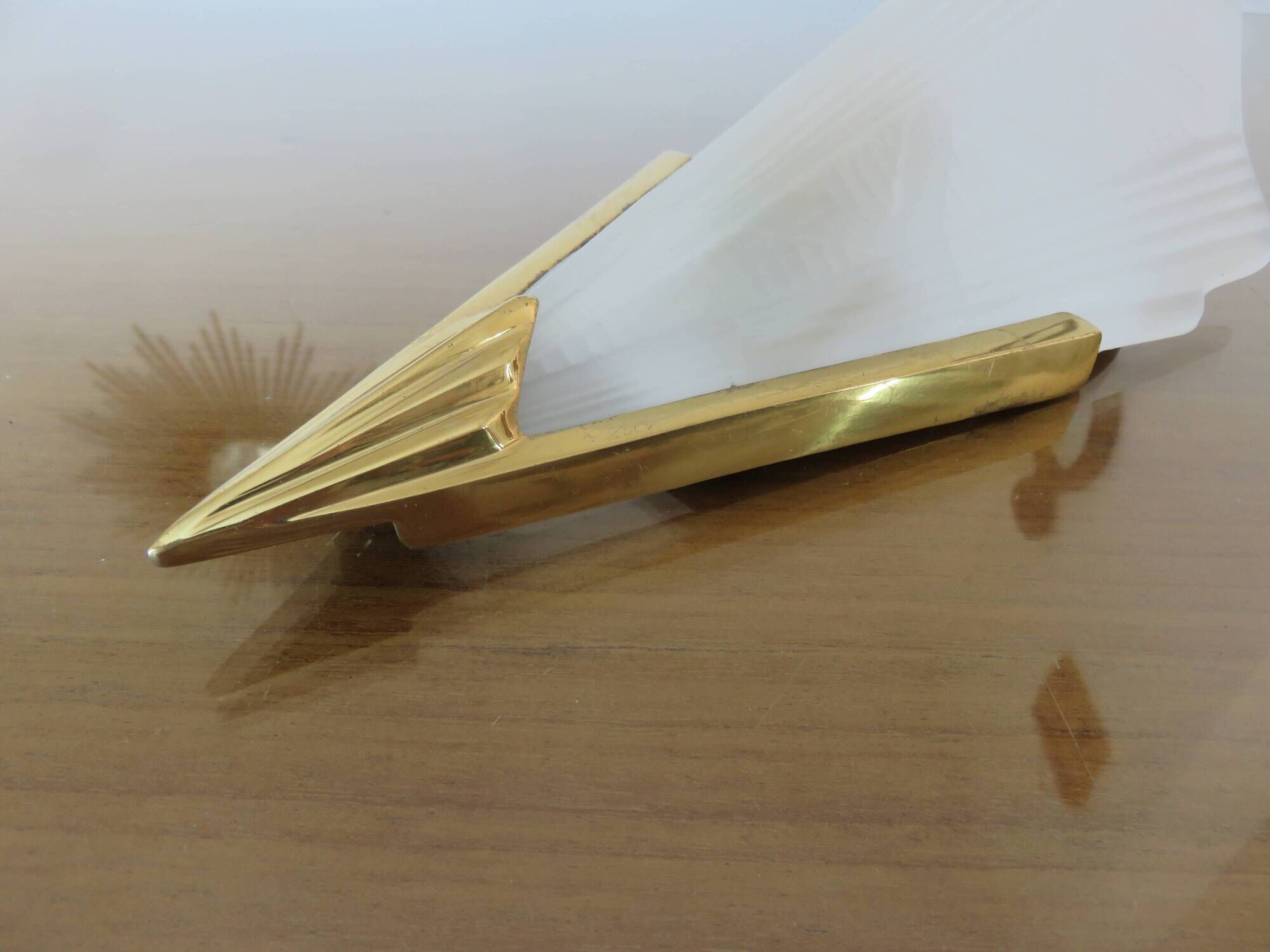 Art Deco wall light in brass and thick frosted glass.