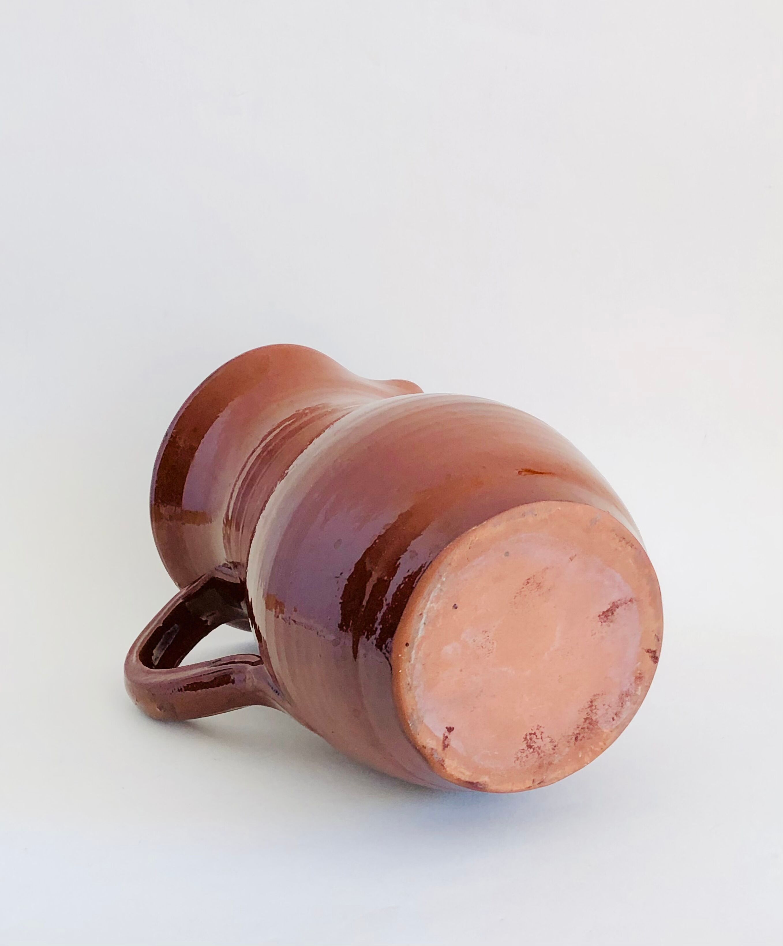 Vintage pitcher in glazed earth