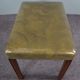 Elegant armchair and footrest in English green leather