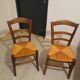 Pair of vintage wooden and woven straw chairs