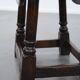Antique English drop-leaf joint stool made of oak from the 18th century
