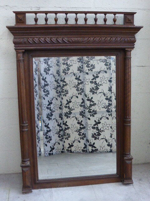 Large mirror beveled Henri II style varnished and carved wooden 128 x 92 cm