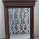 Large mirror beveled Henri II style varnished and carved wooden 128 x 92 cm
