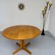 Antique round Scandinavian dining table from the 70s with 1 solid wood extension