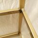 Golden metal shelf and smoked glass