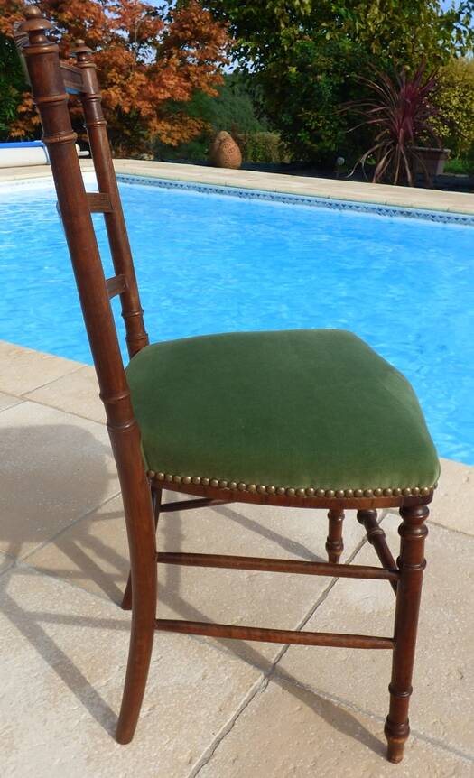 1 solid wood chair with green velvet top and nails