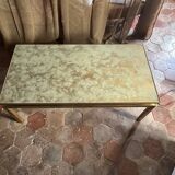 Brass coffee table with shaded lacquer top