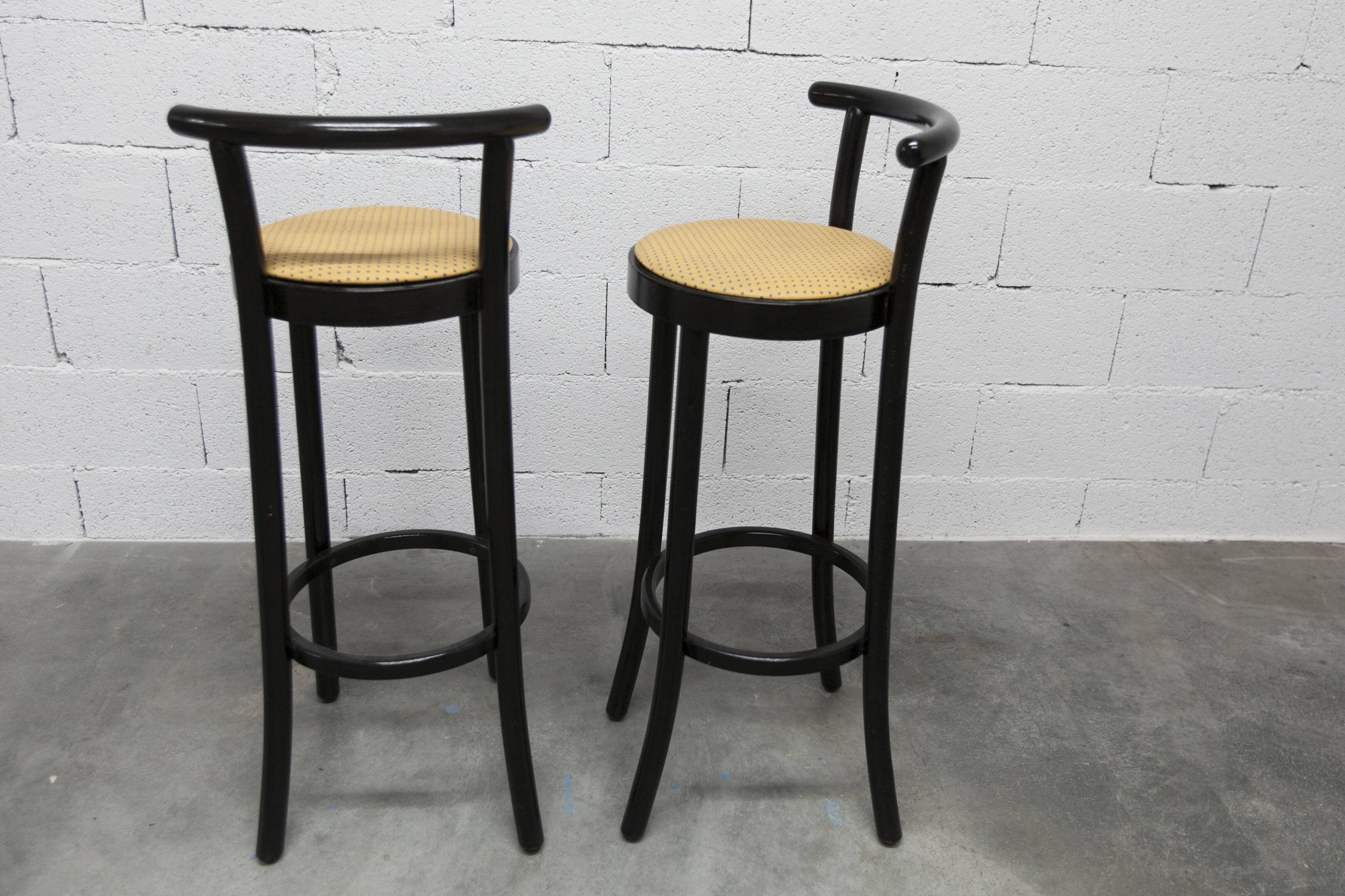 Pair of Baumann stools model Dialog in black and yellow and blue faux leather 1990
