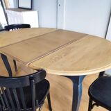 Antique extendable round table with Louis XV style extension