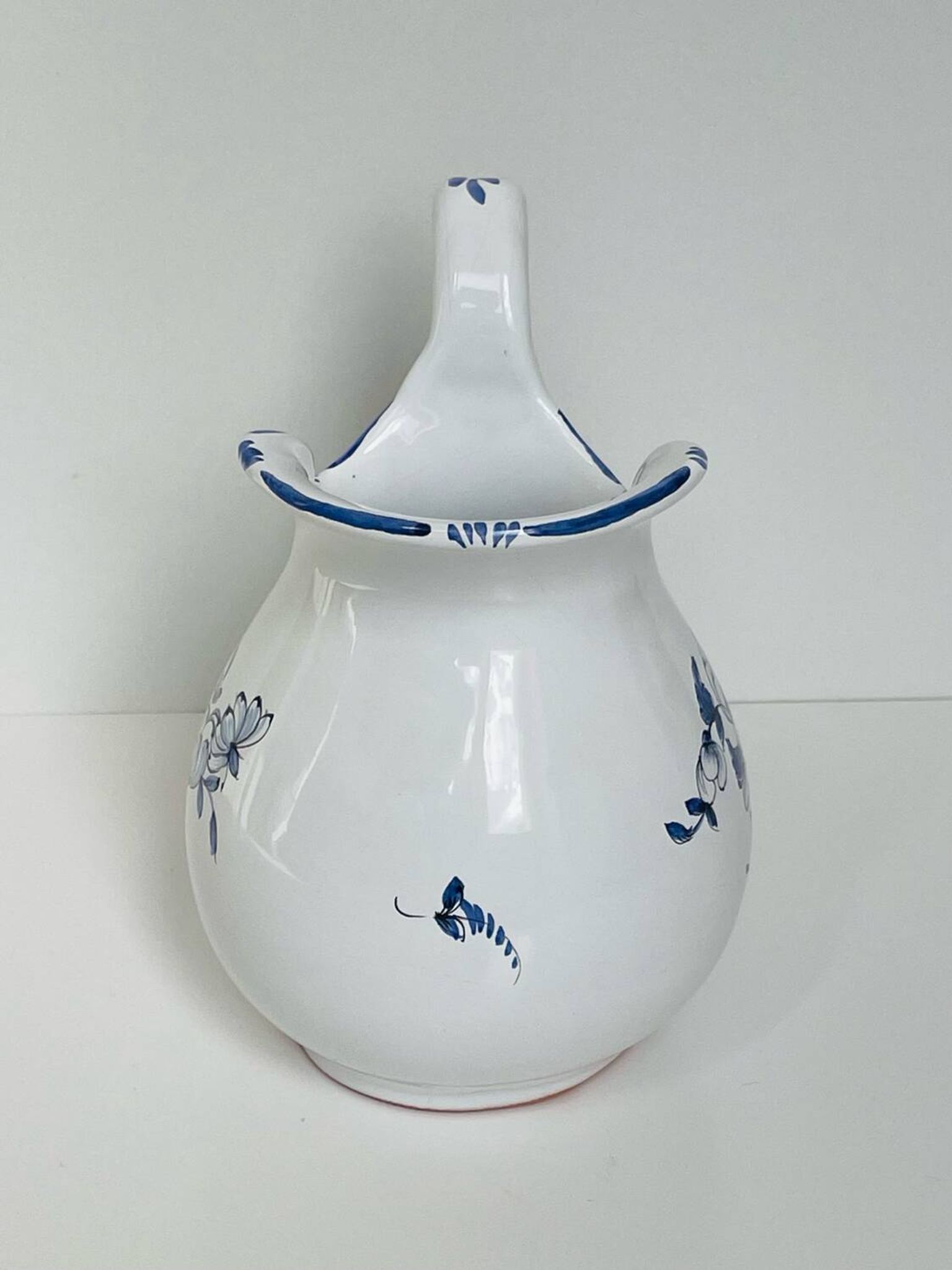 Moustiers pitcher with blue floral decoration