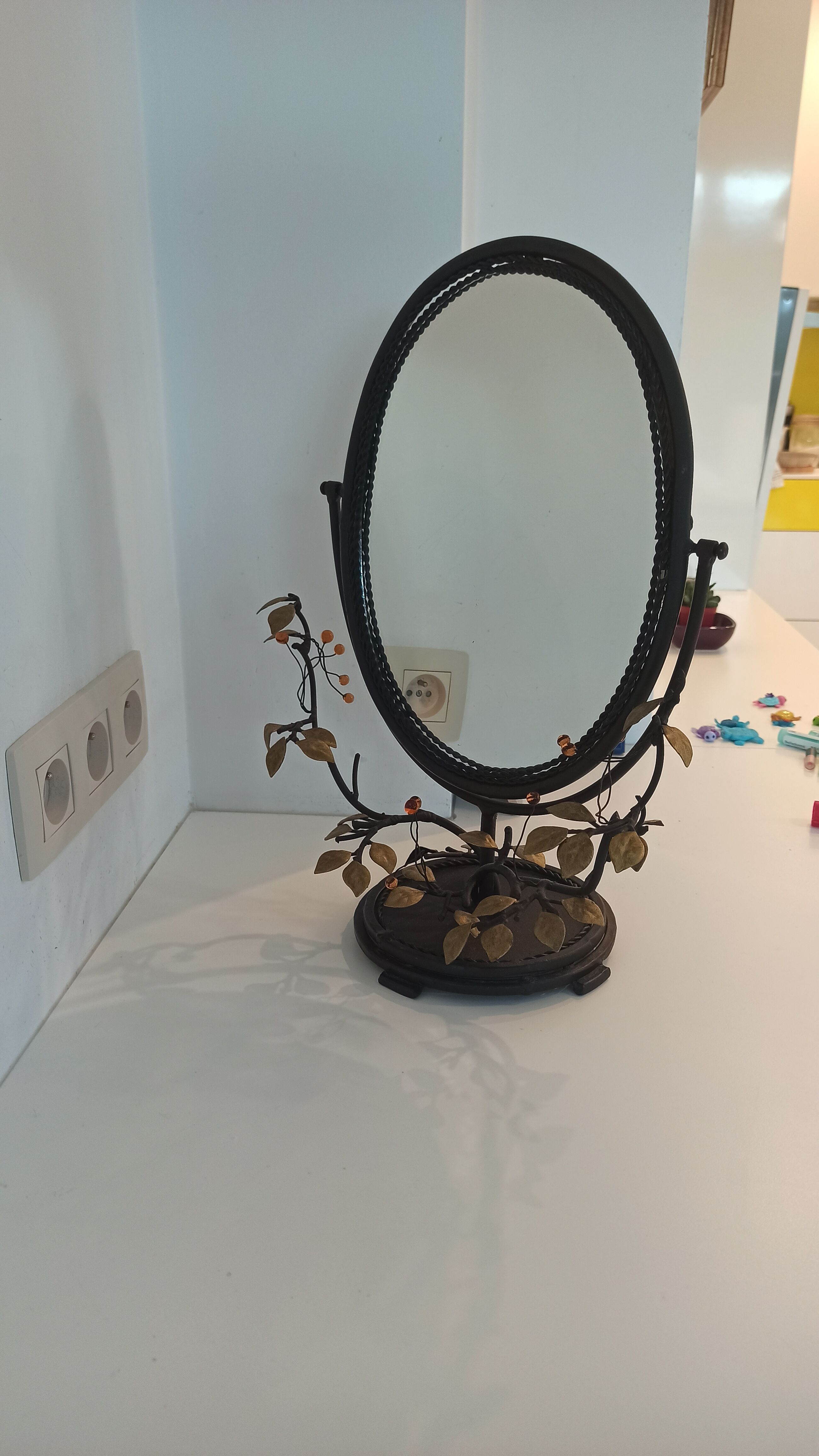 Table mirror, tilting psyche in patinated bronze decorated with leaves and fruits