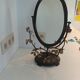Table mirror, tilting psyche in patinated bronze decorated with leaves and fruits