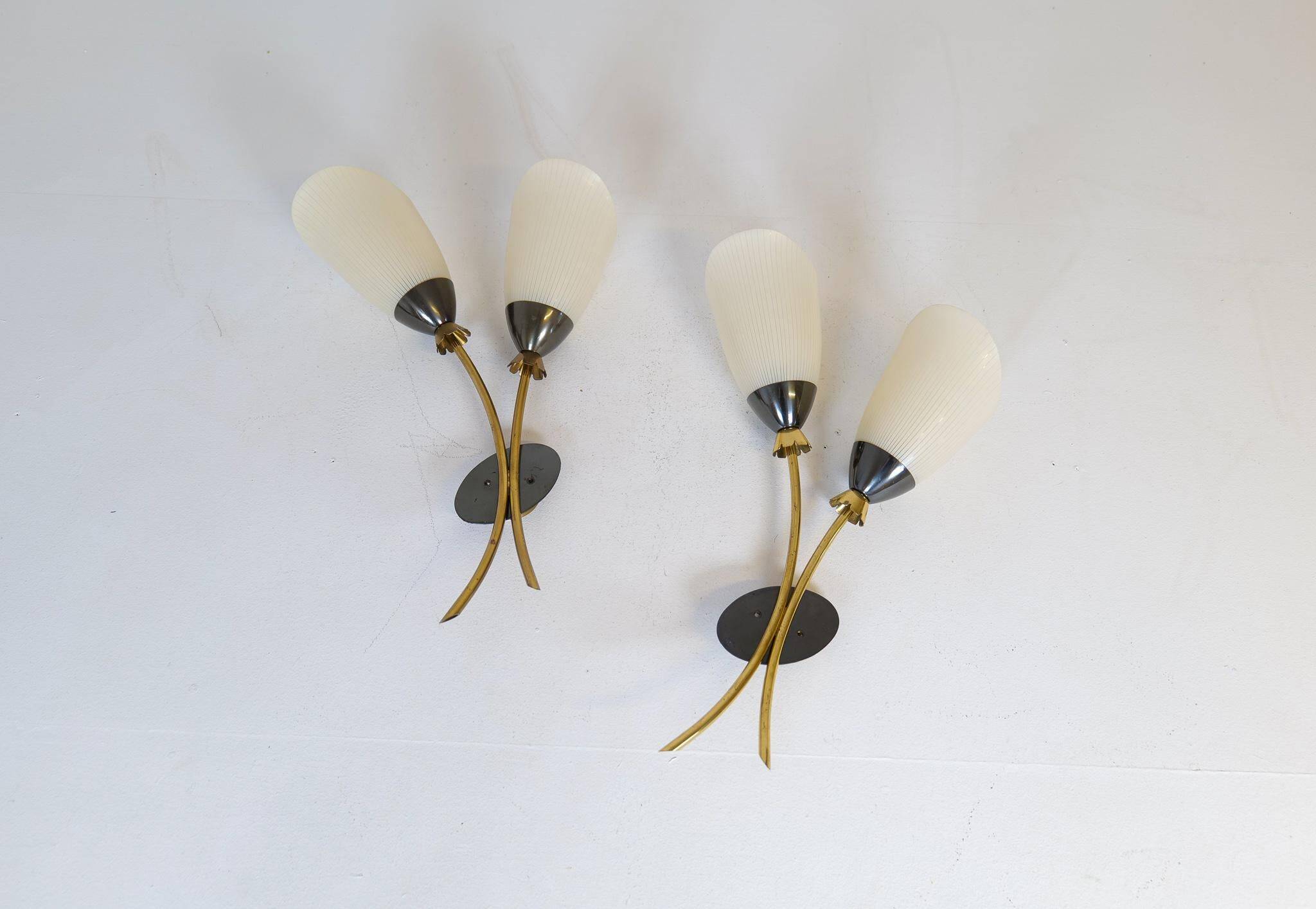 Mid-century pair of wall lamps in brass and opaline attributed to Asea Sweden, 1950s.