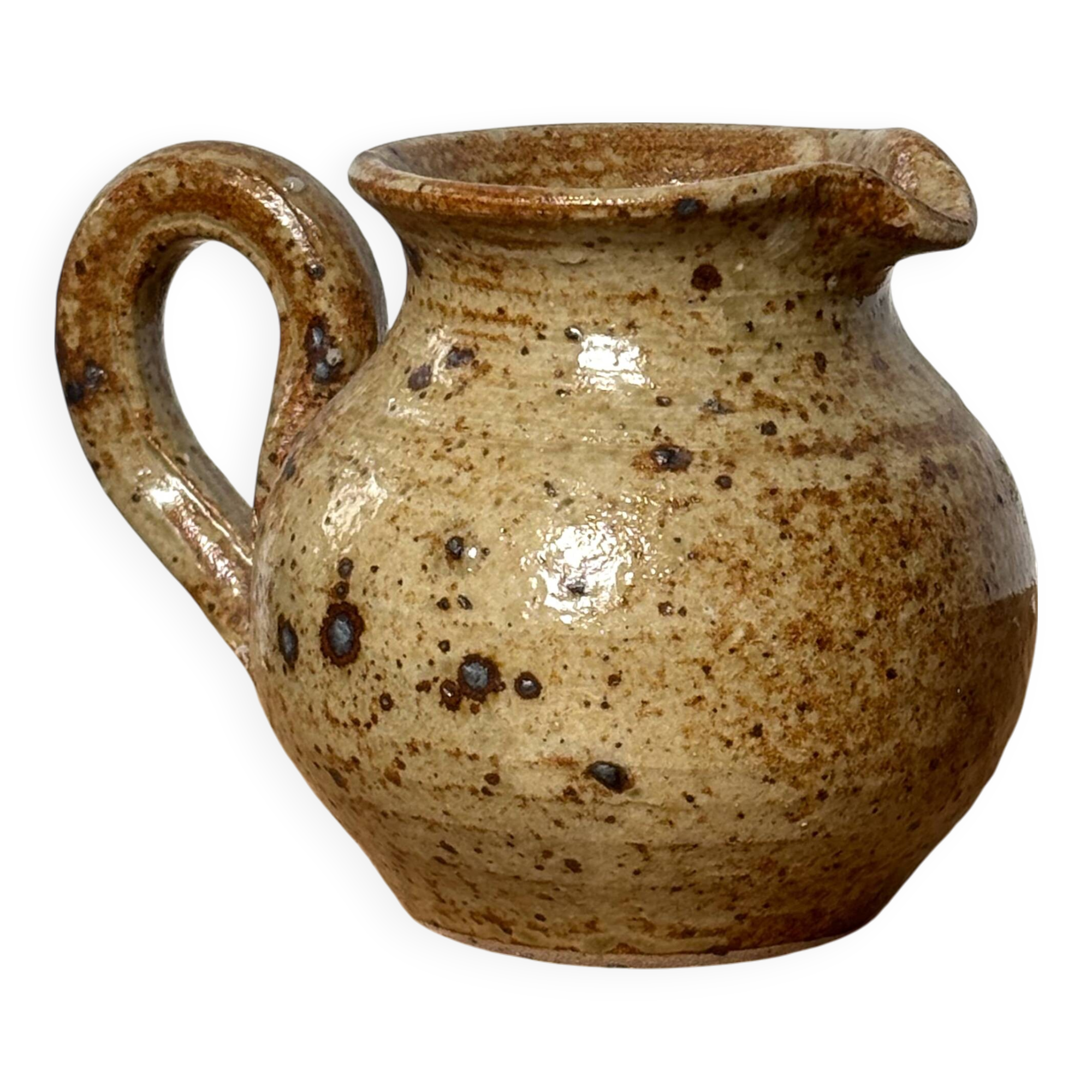Small beige speckled stoneware pitcher