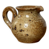 Small beige speckled stoneware pitcher