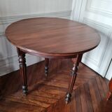 Family half-moon table in walnut hue.