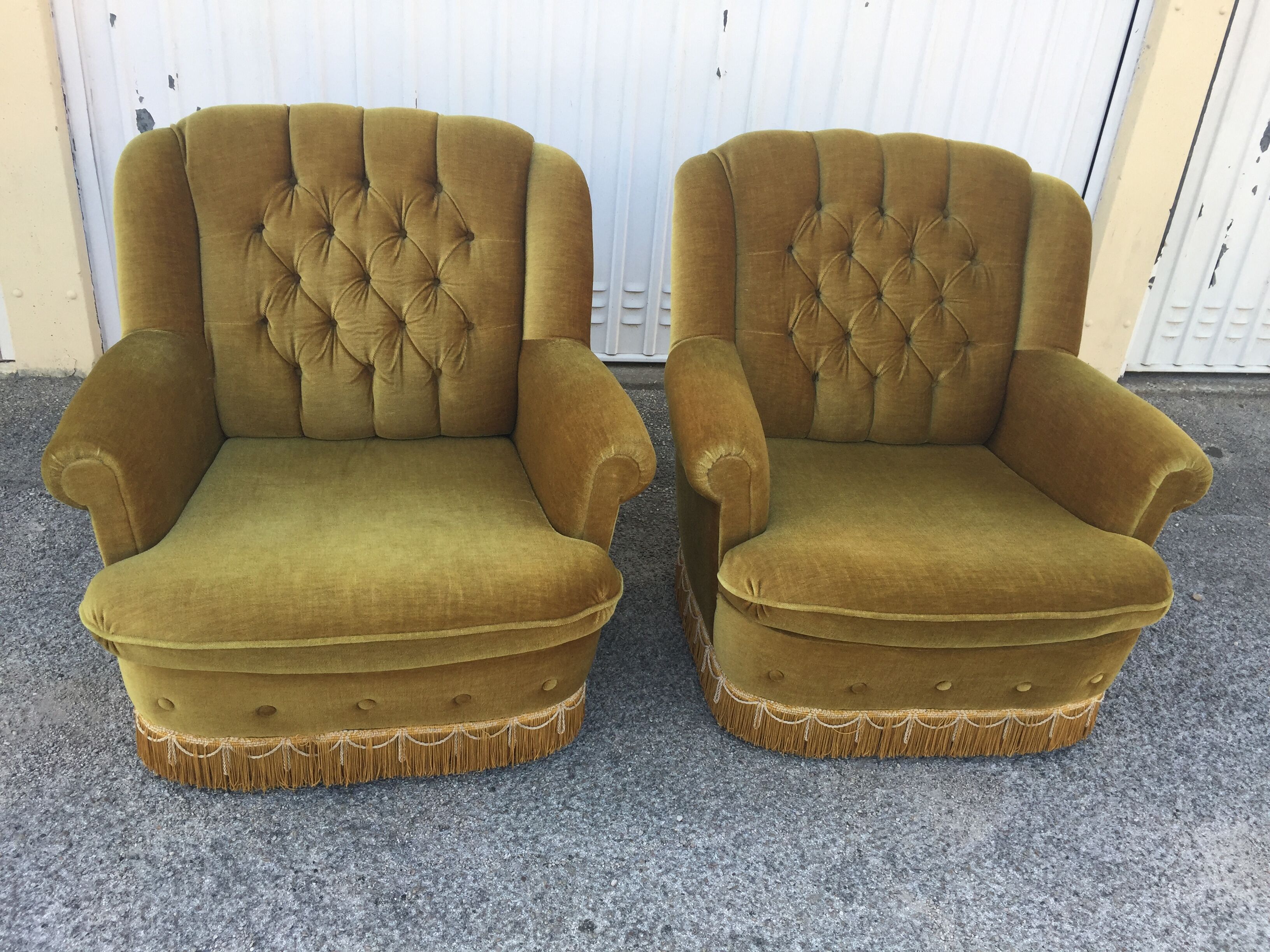 Pair of upholstered velvet armchairs
