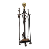 Antique fireplace set in solid wrought iron and brass.
