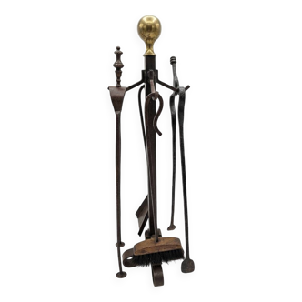 Antique fireplace set in solid wrought iron and brass.