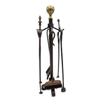 Antique fireplace set in solid wrought iron and brass.