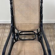 Rocking chair in blackened curved wood and cane, 1900s
