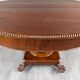 Oval Empire-style table with a central pedestal, 19th century.