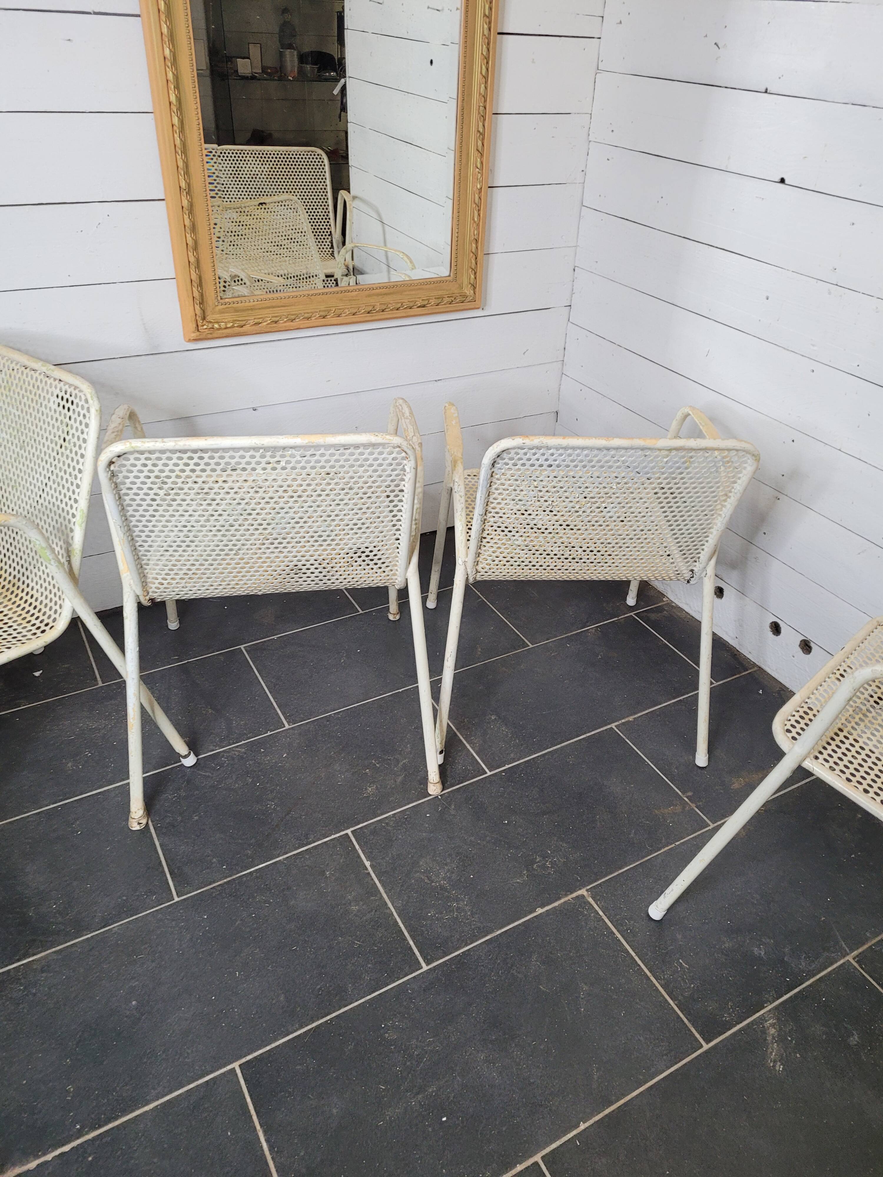 4 perforated metal garden armchairs