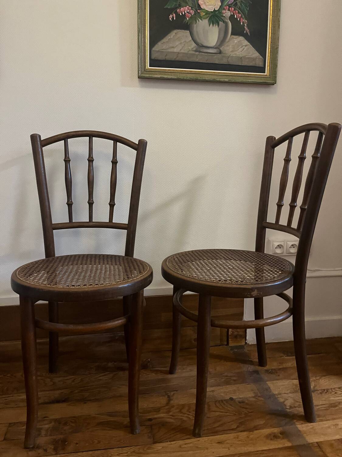 Pair of antique caned bistro chairs stamped Fischel